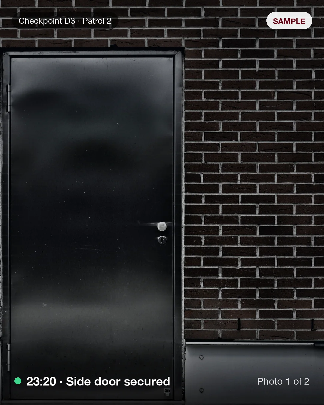 Example patrol photo: a closed steel side door in a brick wall at night, time-stamped 23:20
